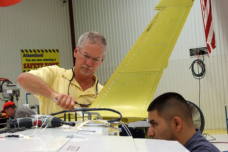 Mark Huffstutler and technician installing winglet